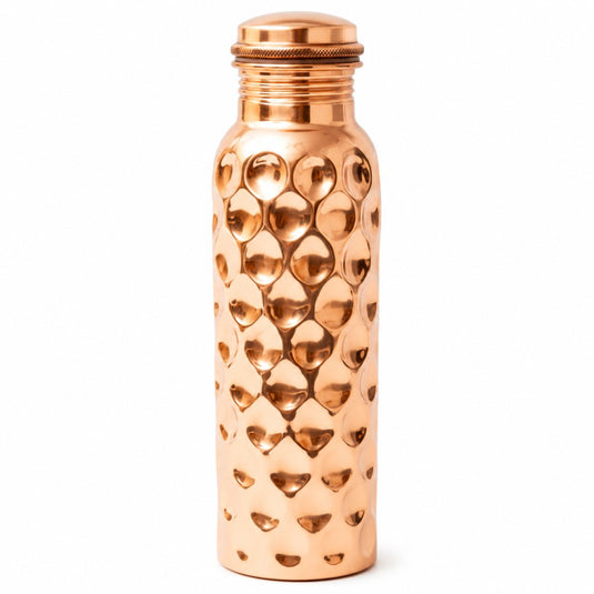 Copper water bottle with textured design on a white background
