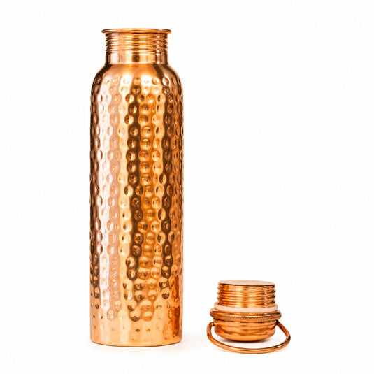 Copper water bottle with a textured design on a white background