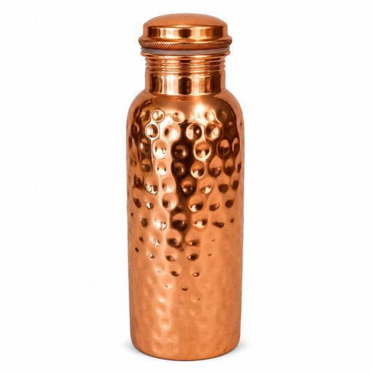 Copper water bottle with a textured surface on a white background