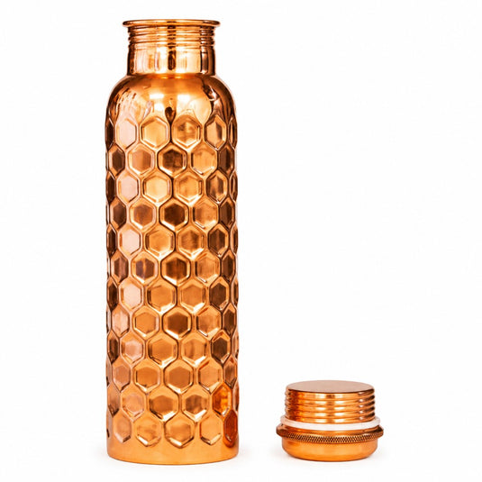 Copper honeycomb-patterned water bottle on a white background